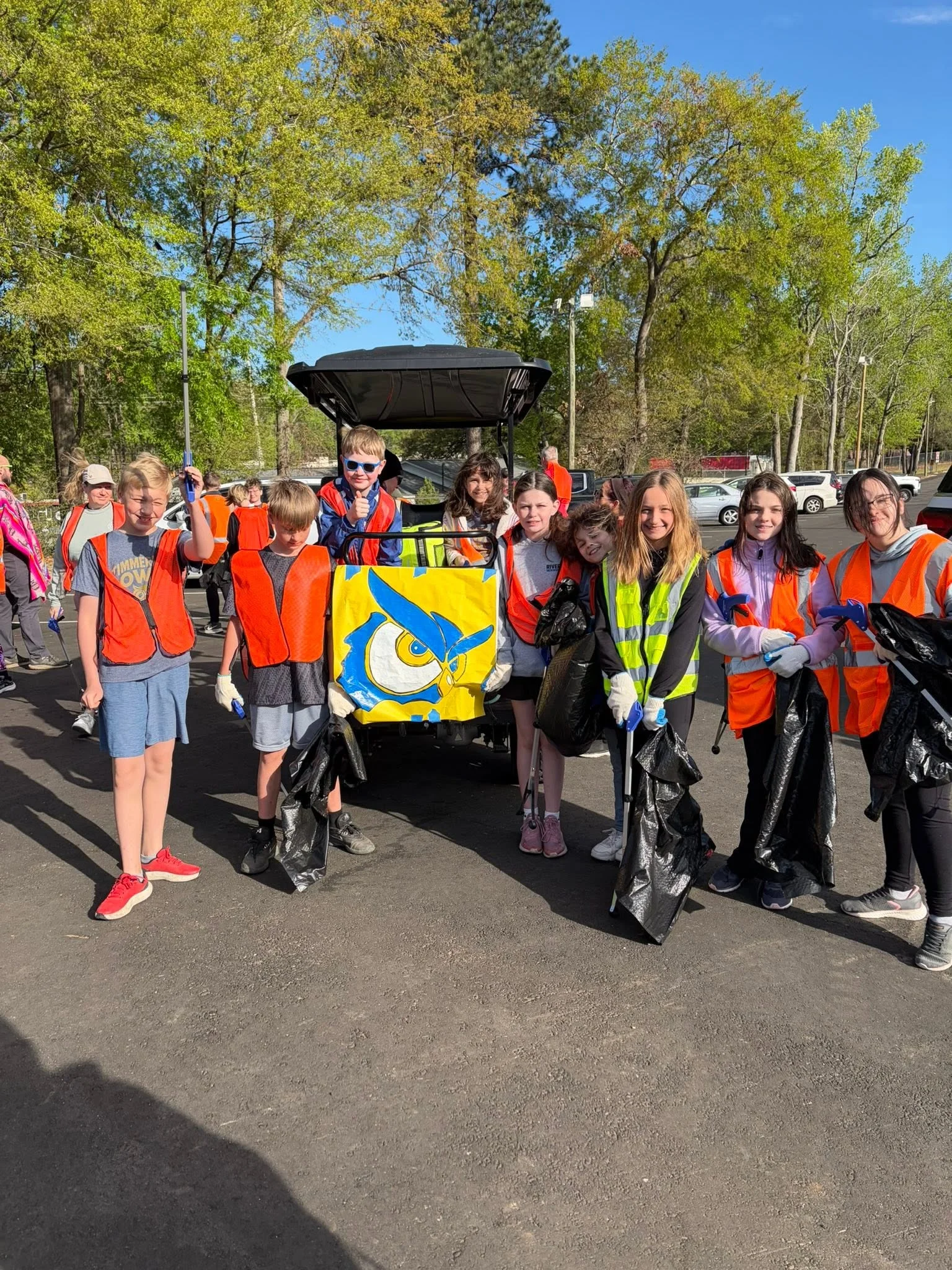 Beta club volunteers on the roadside during cleanup